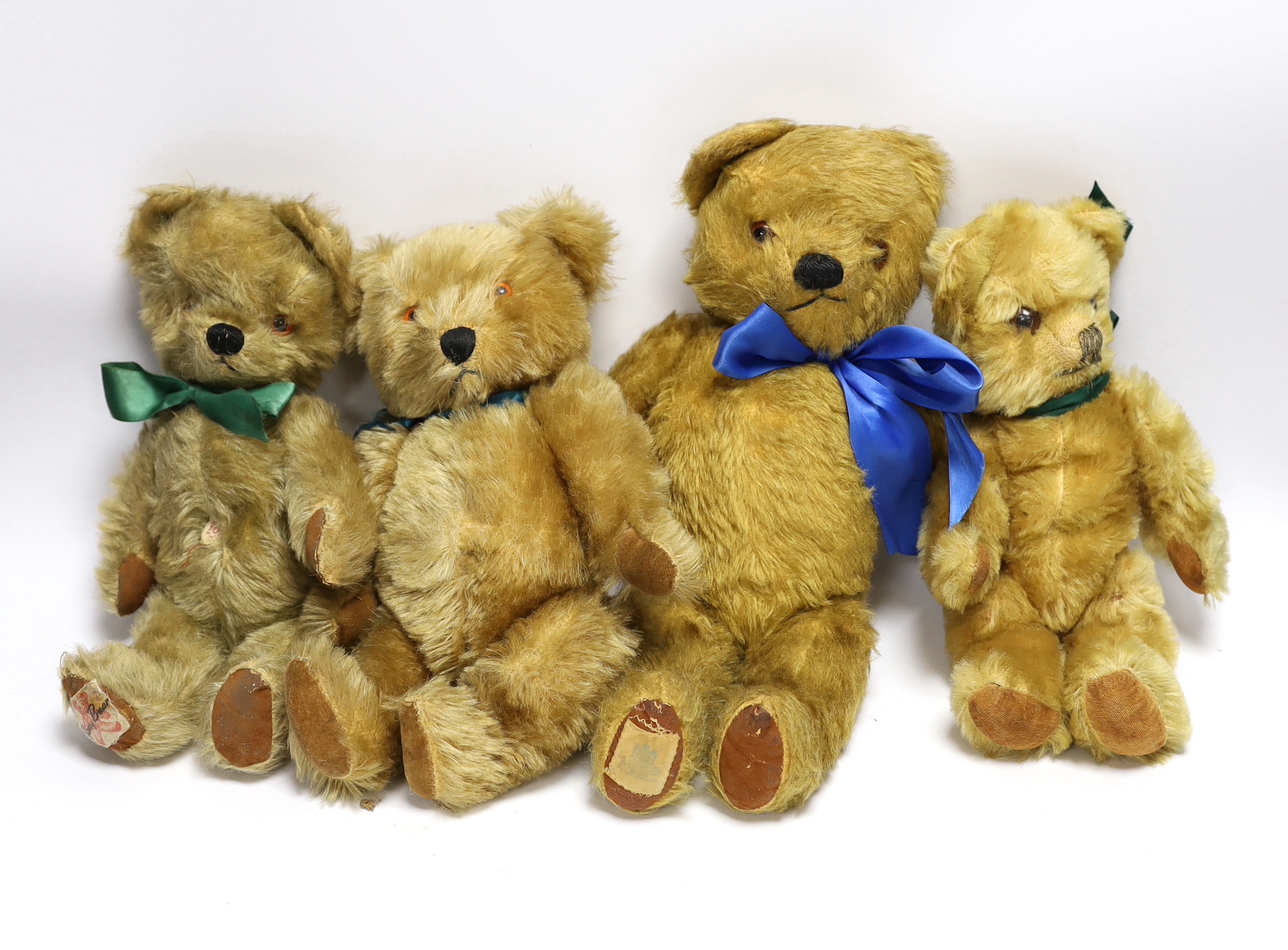A 1950's Chiltern, excellent condition, a 1950's Chad Valley, excellent condition, a 1950's Chad Valley with label, and a 1950's bear, good condition (4)
